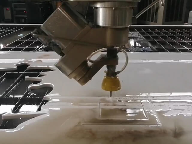 What are the capabilities of the 5-axis water jet machine?